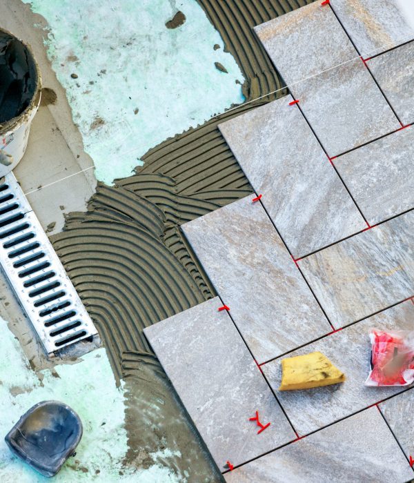 Laying garden paving with all the tools necessary for the tiler.